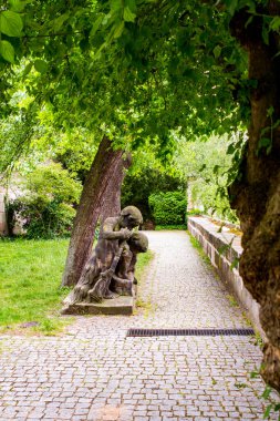 Medieval stone statue of children in the garden of the Nurenberg Palace, Germany