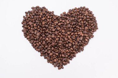 Coffee beans in shape of heart. coffee beans isolated on white background.
