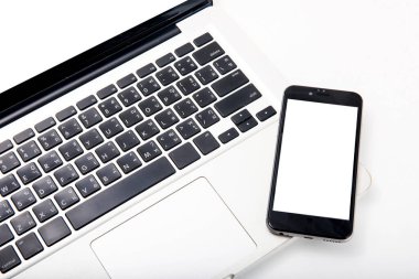 Closeup picture of a keyboard with a phone