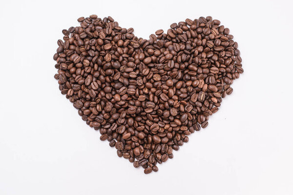 Coffee beans in shape of heart. coffee beans isolated on white background.