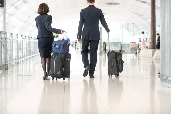 Airport terminal hall. Walking travelers