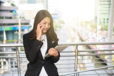 Successful businessman working at laptop in City