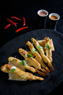 Thai Pork satay - Grilled pork served with peanut sauce or sweet and sour sauce - Asian food style - Closeup