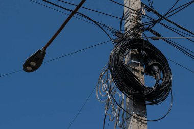 Electric cables on street lighting pole