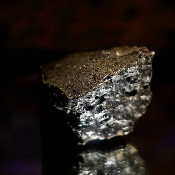 iron meteorite in a brown cover