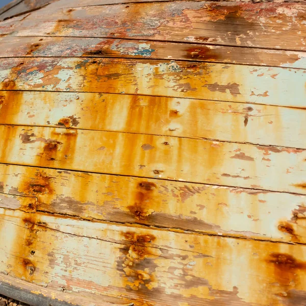 14. The boat is covered in rust