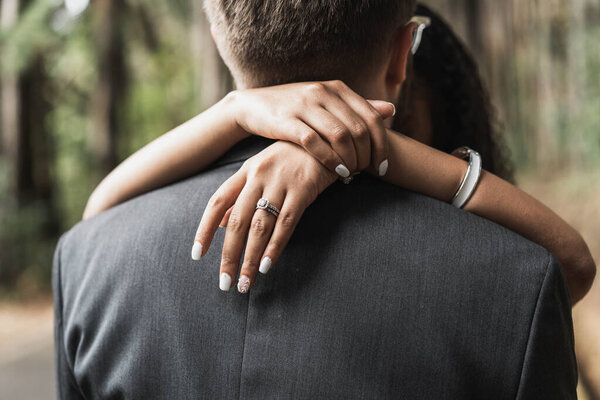 couple in love, man and woman, holding hands, looking at camera, close up