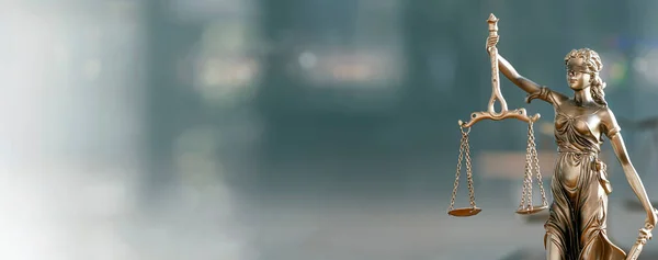 Legal and law concept. Statue of Lady Justice with scales of justice and wooden judge gavel on wooden table. Panoramic image statue of lady justice.