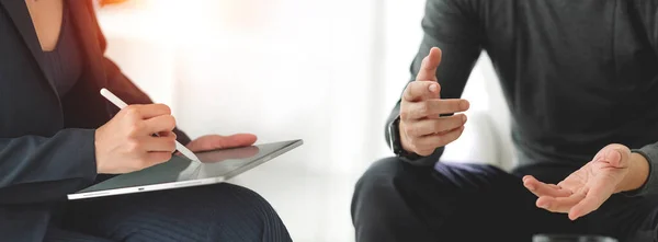 Business people advisor talking, planning analyze investment and marketing on tablet in office. Casual meeting.