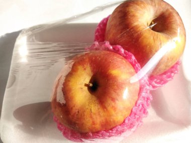 red apples isolated on white background, Apples are known to be low in calories and contain a variety of vitamins and minerals, such as vitamin A, vitamin B6, vitamin C, and potassium.