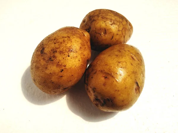potato isolated on a white background.Potatoes, sweet potatoes, dutch yams, or bengal yams are plants of the Solanaceae tribe that have edible stem tubers and are called potatoes.