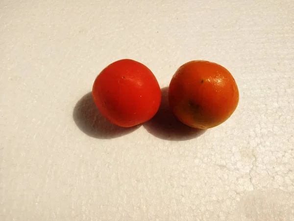 tomato isolated on a white background. high angle viewTomato is a plant of the Solanaceae family, native to Central and South America.