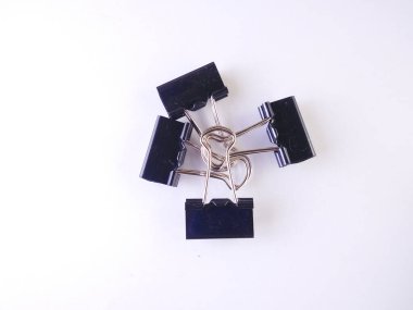 Office black paper clip isolated on white background.high angle view.