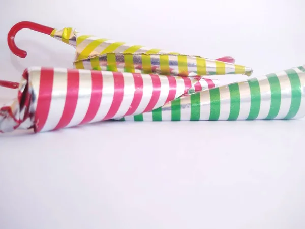 Chocolate Shaped Umbrella Wrapped Aluminum Foil Strip Motif Isolated White — 스톡 사진