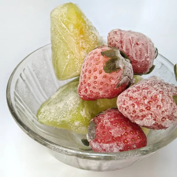 frozen strawberry and frozen melon isolated on white background