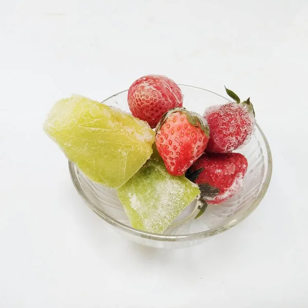 frozen strawberry and frozen melon isolated on white background