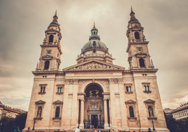 The Saint Stephens Basilica, in the old town of Budapest. Neoclassical Roman Catholic church. Architectural theme. Religious architecture. Retro photo filter.