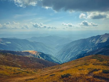 Mountain valley canyon landscape under blue sky. Wonderful autumn scene with orange grass. Beautiful nature background. Vintage retro tone. Travel, hiking, climbing, tourism. Carpathian mountains