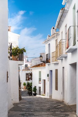 FRIGILIANA, SPAIN - January 28 2022: Situated in South of Spain, Frigiliana is a touristic travel destination, a village situated on the hills, with white houses, small roads. Typically Andalusian