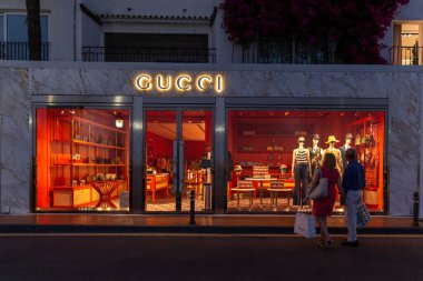 Marbella, SPAIN - July 16 2020: Night photography in luxury and famous location of Marbella -Puerto Banus  Bay. View of GUCCI Store, in the shopping area of the harbour. Costa del Sol - Malaga
