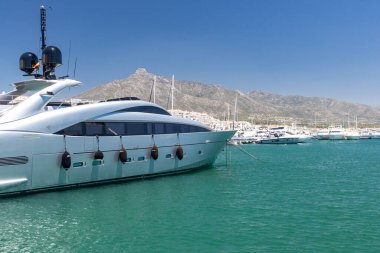 Marbella, SPAIN - July 16 2020: Luxury Puerto Jose Banus Harbour situated in Nueva Andalucia area of Marbella city. Luxury lifestyle with expensive yachts, shopping area with exclusive stores