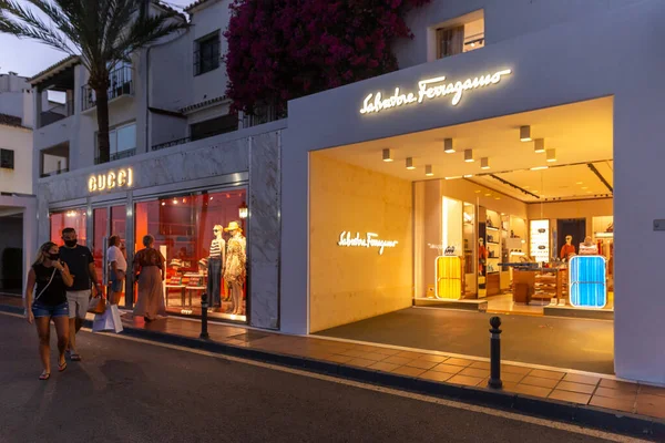 Marbella, SPAIN - July 16 2020: Night photography in luxury and famous location of Marbella -Puerto Banus  Bay. View of Salvatore Ferragamo Store, in the shopping area of the harbour