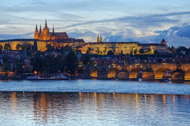 Prague Castle with Charles Bridge and Vltava river after sunset, Prague, Czech Republic