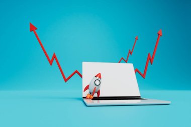 Online gelir artışı grafiği. Laptop, roketi ve kırmızı okları mavi arka planda çıkarıyor. 3 Boyutlu Hazırlama.