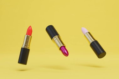 Sarı arka planda uçuşan farklı renkte ruj tüpleri. 3 Boyutlu Hazırlama.