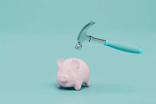 breaking the piggy bank to get money. piggy bank and hammer on a blue background. 3D render.