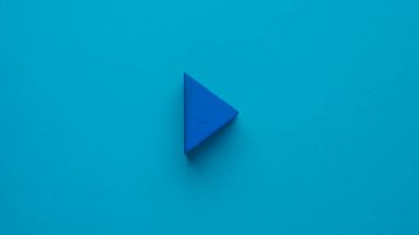 Blue triangle in the shape of the play button