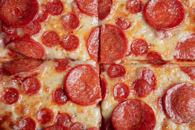 Detail of greasy pepperoni pizza