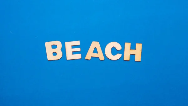 Wooden Letters Plain Colored Background Word Written English Beach — Foto de Stock