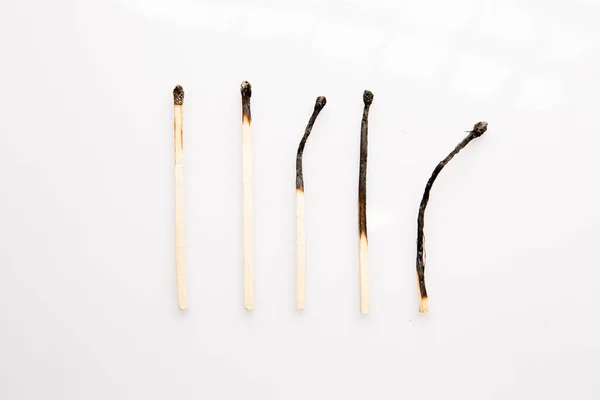 Small Burnt Wooden Matches White Background - Stock-foto