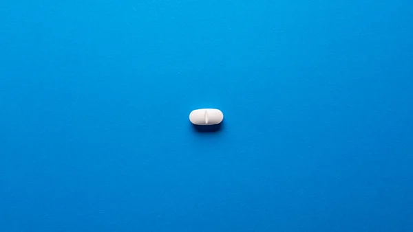 One Medicine Pill Blue Background — Zdjęcie stockowe