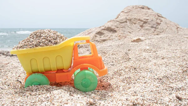 Orange Yellow Plastic Toy Truck Loaded Sand Beach — Foto de Stock