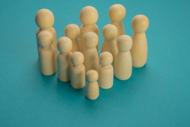 Groups of wooden tokens simulating people of different types grouped in a demonstration