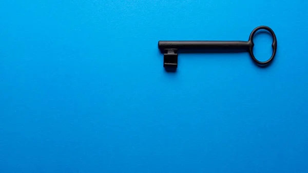 Black Old Key Blue Color Background — стоковое фото