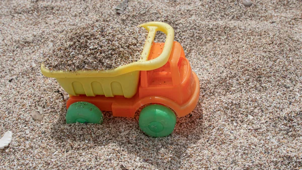 Orange Yellow Plastic Toy Truck Loaded Sand Beach — Foto de Stock