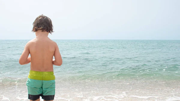 Four Year Old Boy Swimsuit Back Looking Beach — стоковое фото
