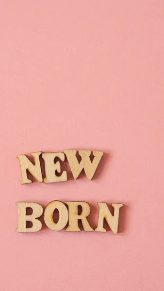 Word New Born Written English Wooden Letters Pink Background — Stockfoto