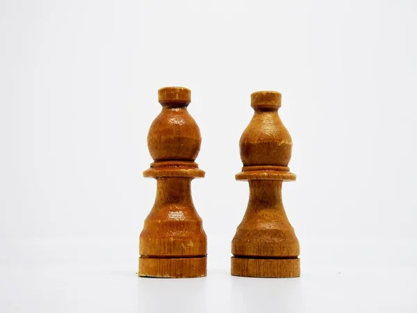 the bishop character in this chess game are made in the traditional way, using coconut wood and colored in brown