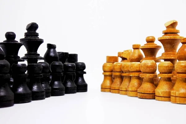 the ranks of the war troops in this chess game is face to face, made with traditional way, using coconut wood and colored in black and brown