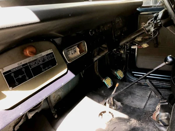 the front cabin of an old car along with a panel with a classic model that still functions well