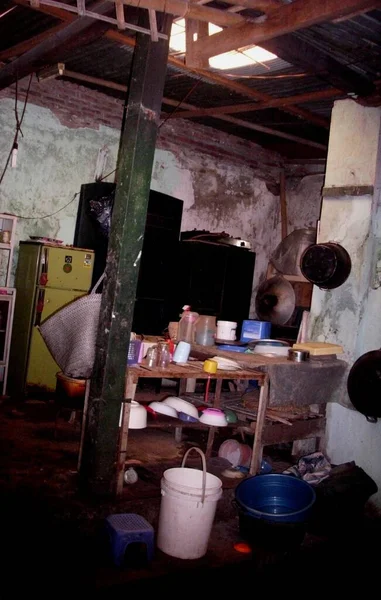 the kitchen room that looks shabby in a house that is quite old due to lack of care from the owner of the house