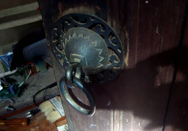 This unique and original antique door handle is still functioning and well maintained