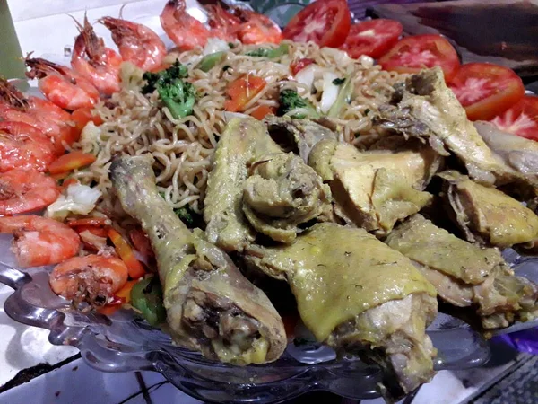 Special fried noodles on a special day with various toppings that are very appetizing