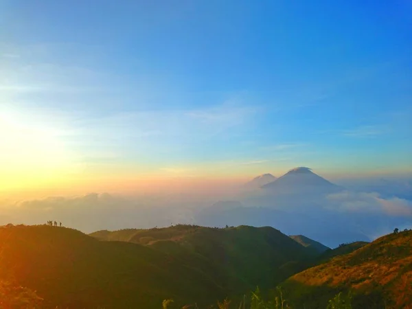 The prau Mountain on sunrise with merbabu mountain, One of the most beautiful mountains in Java Island, the peak is beautiful and the nature is extraordinary