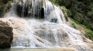 Waterfall from upper hill water flow by gravity