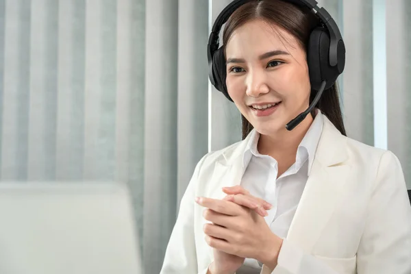 Female call center provides information to a customer calling for help, Contact us, Service with a beautiful and friendly voice, Long distance communication, Talk using headphones or headsets.